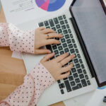 woman-typing-laptop-office
