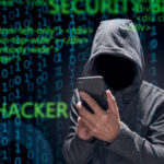 Computer hacker with mobile phone smartphone stealing data