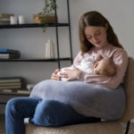 side-view-mother-with-cute-newborn