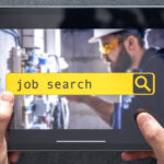 Top view of digital tablet with search job on screen in male hands.