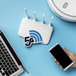 top-view-wi-fi-router-with-laptop-vacuum-cleaner