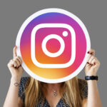 Woman holding a social network icon