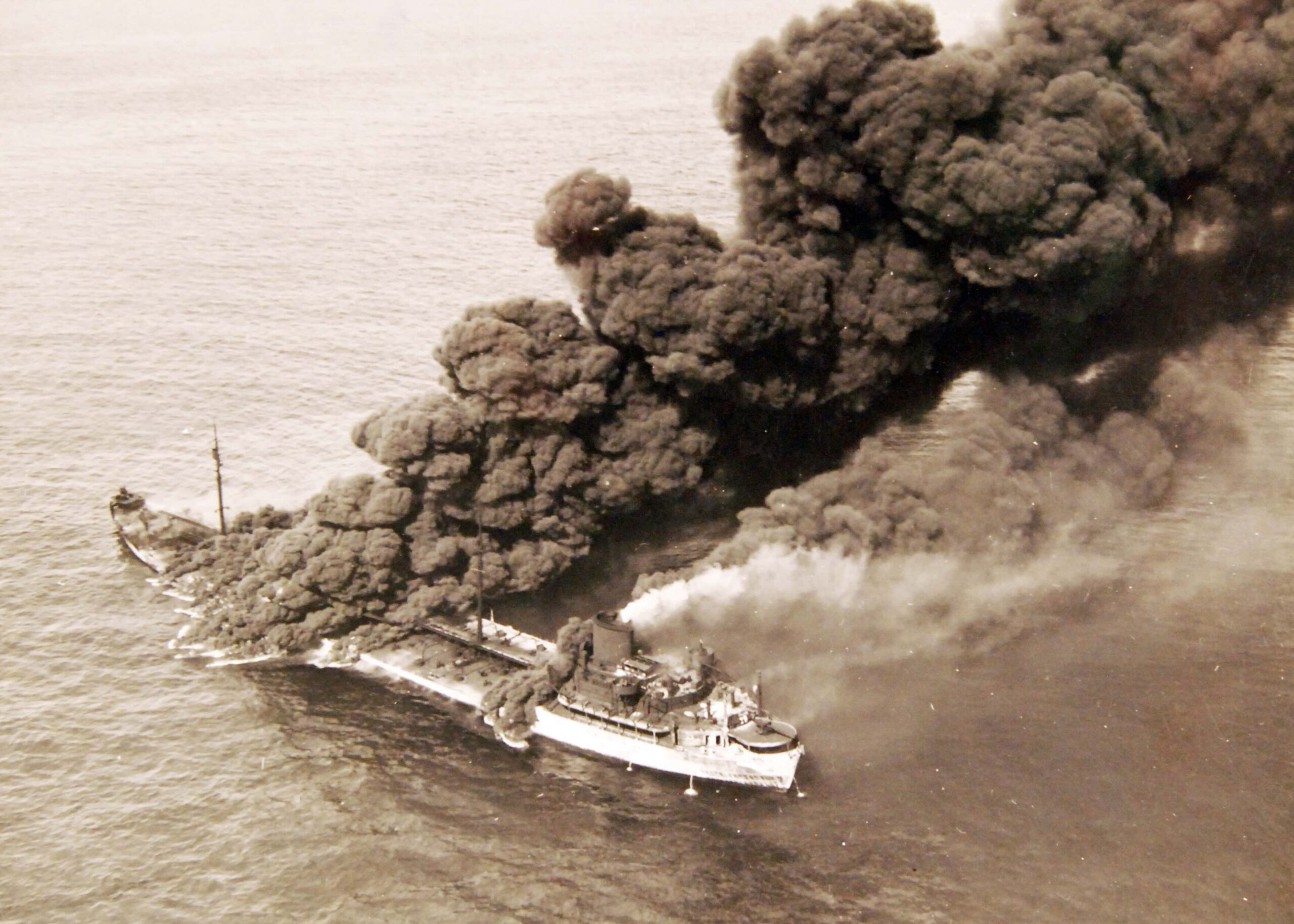 80-G-61599:  German U-boat attacks, WWII.  SS Pennsylvania Sun burning after being torpedoed amidships by a torpedo by U-571 on July 15, 1942.   Official U.S. Navy Photograph, now in the collections of the National Archives.  (2017/06/13).