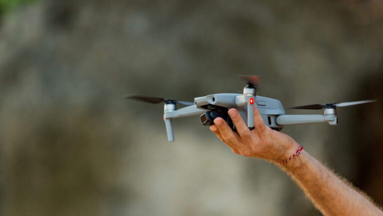 drone takes off from hand. natural background