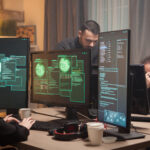 Female hacker with her team of cyber terrorists